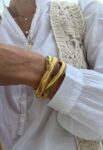 Pulsera serpentine triple dorada